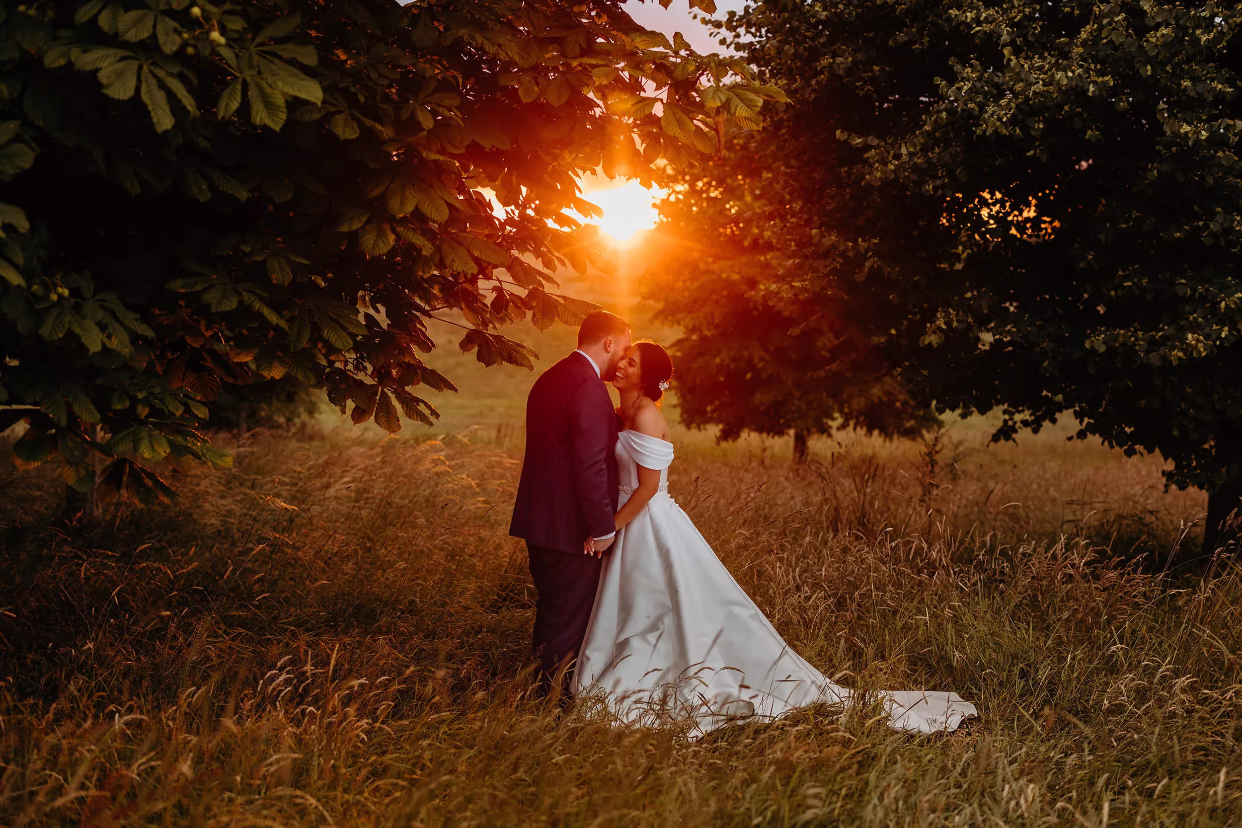sunset with bride and groom getting close