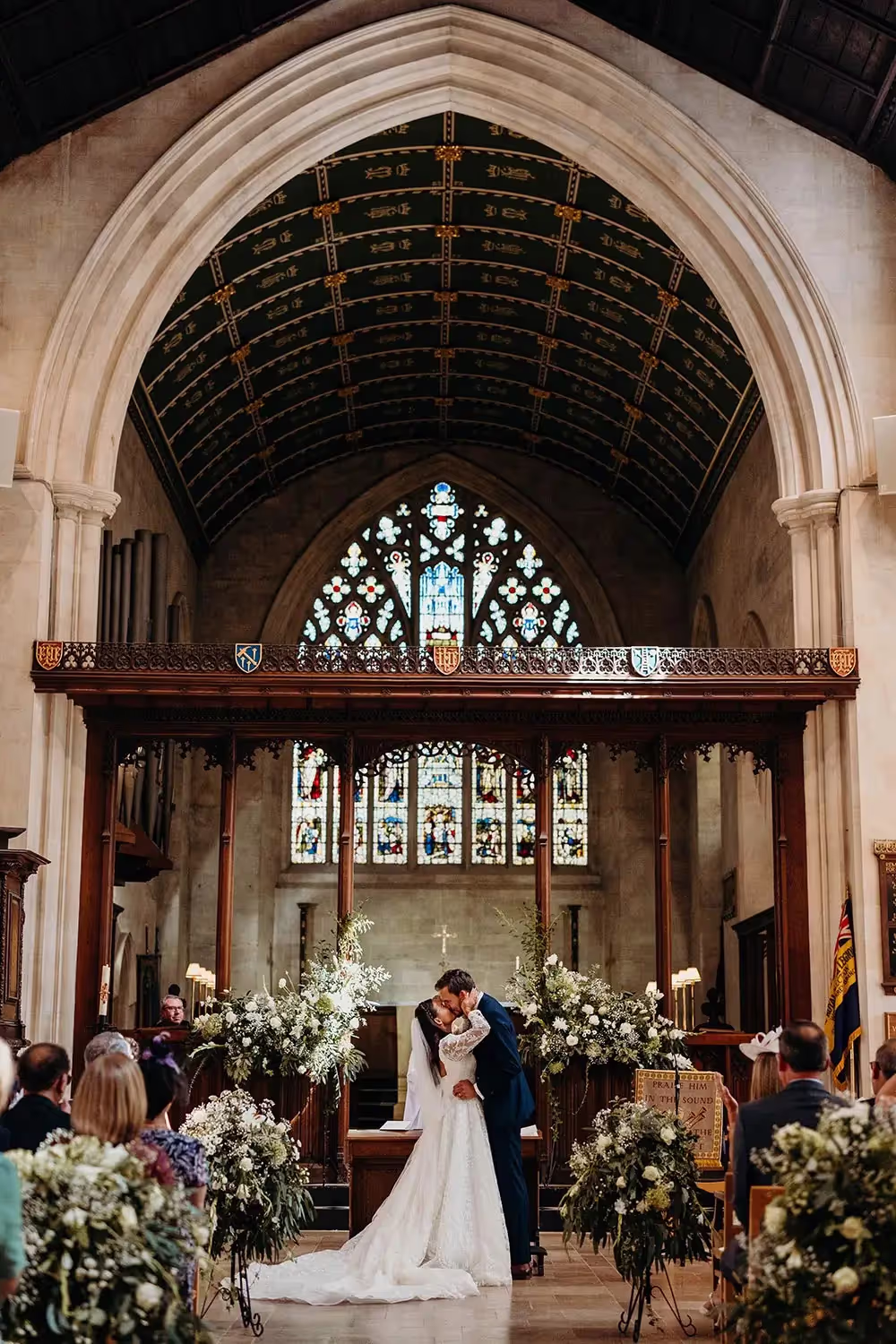 bride and groom first kiss at grand church in Richmond